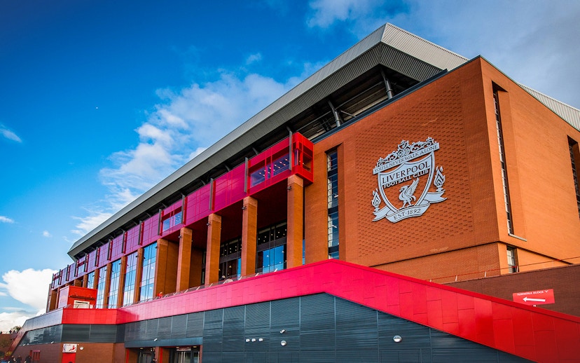Liverpool FC stadium exterior with club crest, part of Legends Q&A and Stadium Tour.
