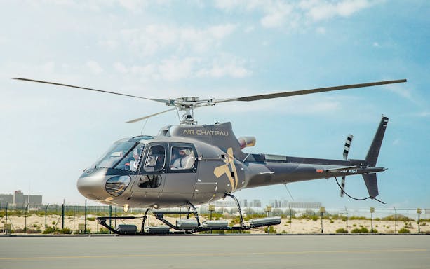Helicopter on tarmac ready for tour with return transfer.