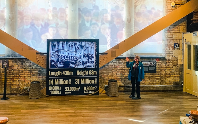 Guide presenting Tower Bridge exhibit details in London.