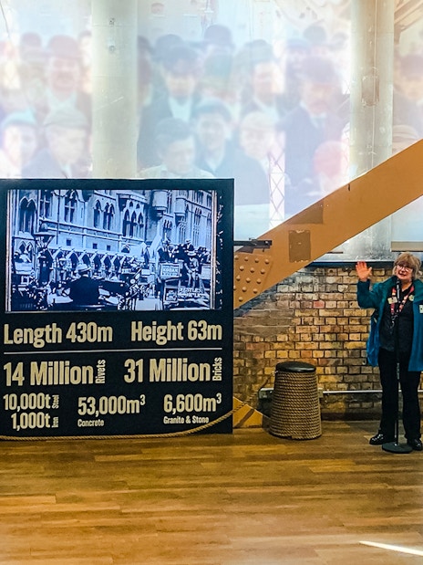 Guide presenting Tower Bridge exhibit details in London.