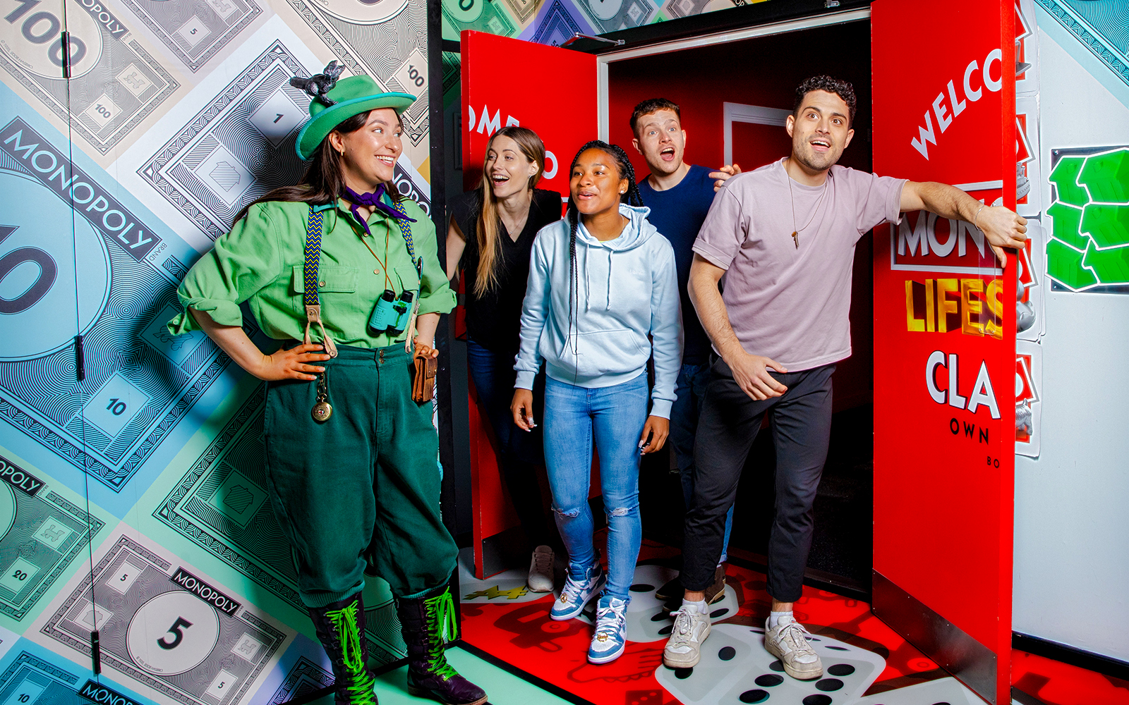 Guests playing a life-sized Monopoly game at Monopoly Lifesized experience in London.