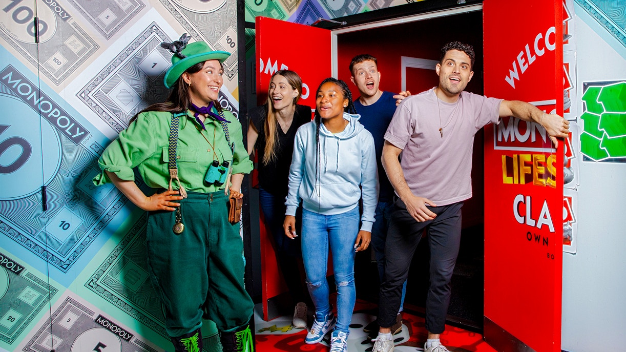 Guests playing a life-sized Monopoly game at Monopoly Lifesized experience in London.
