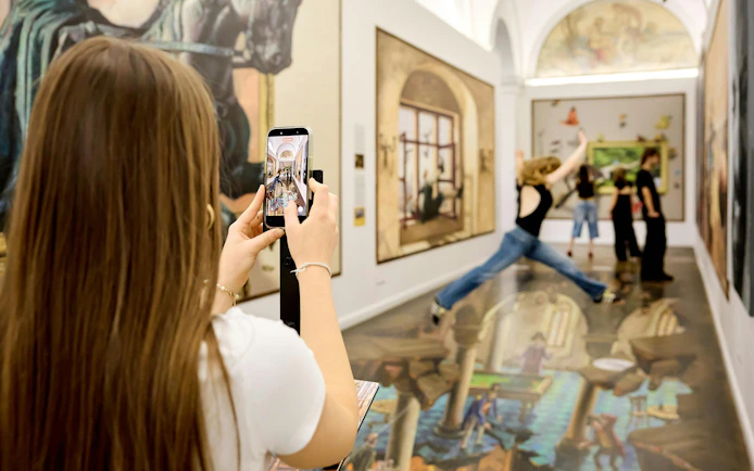 Visitors interacting with 3D art at IAM Illusion Art Museum Prague.
