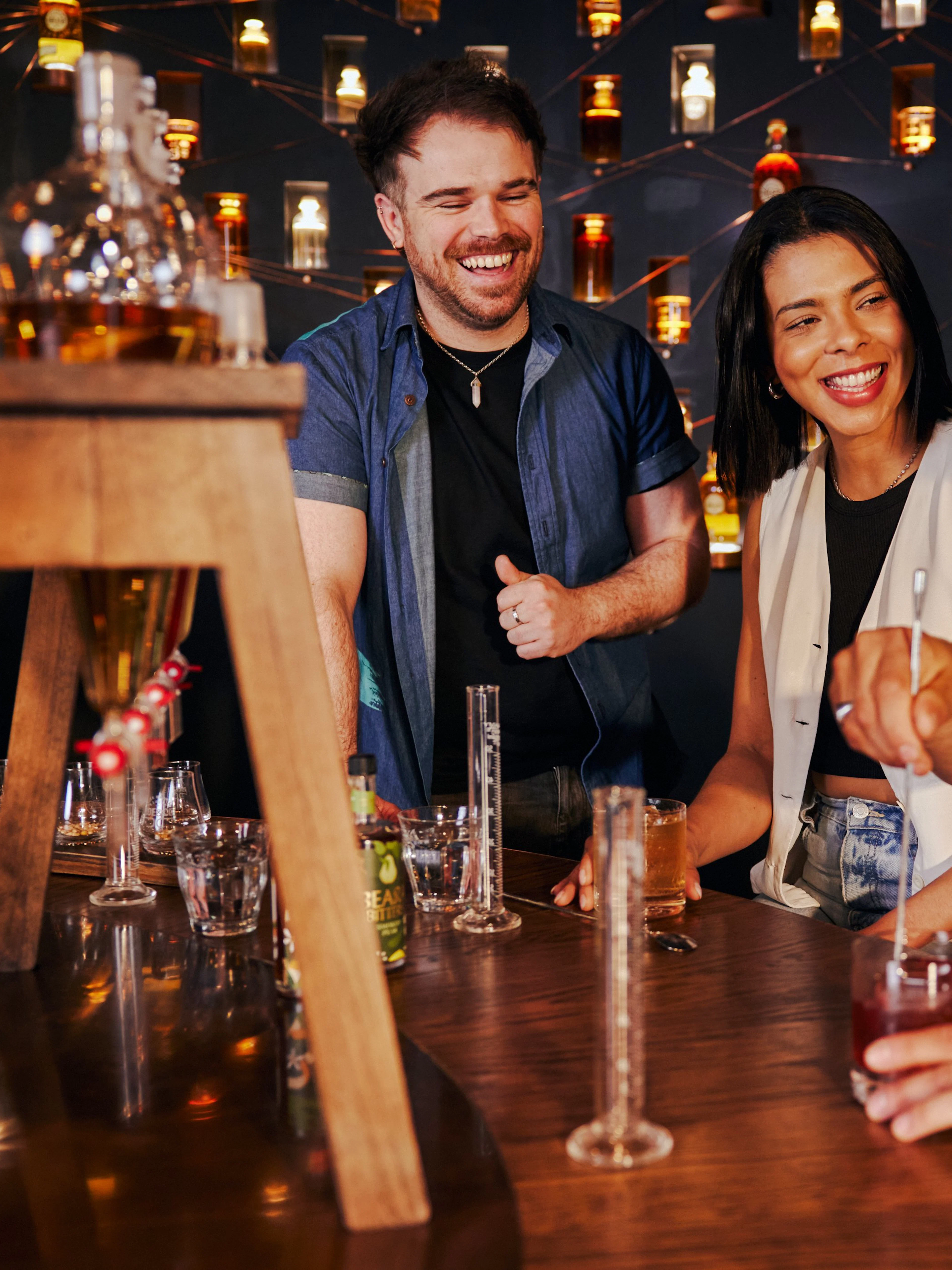 Tourists enjoying a guided tasting experience at Roe & Co Distillery.