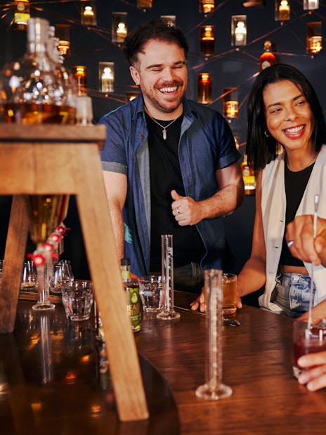 Tourists enjoying a guided tasting experience at Roe & Co Distillery.