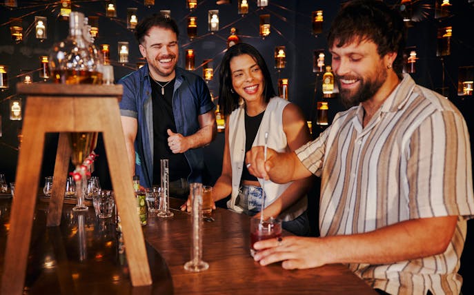 Tourists enjoying a guided tasting experience at Roe & Co Distillery.