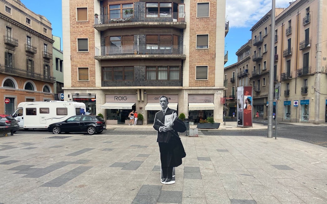 Plaça Major de Figueres with a cutout of a man in front of a building in Catalonia, Spain.