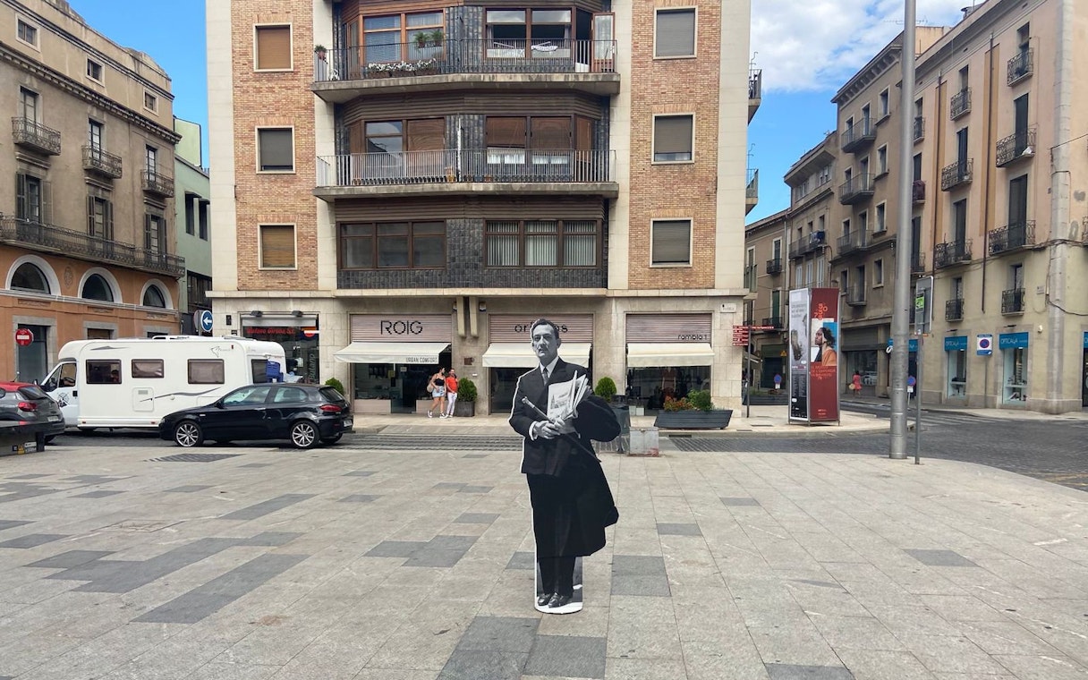 Plaça Major de Figueres with a cutout of a man in front of a building in Catalonia, Spain.