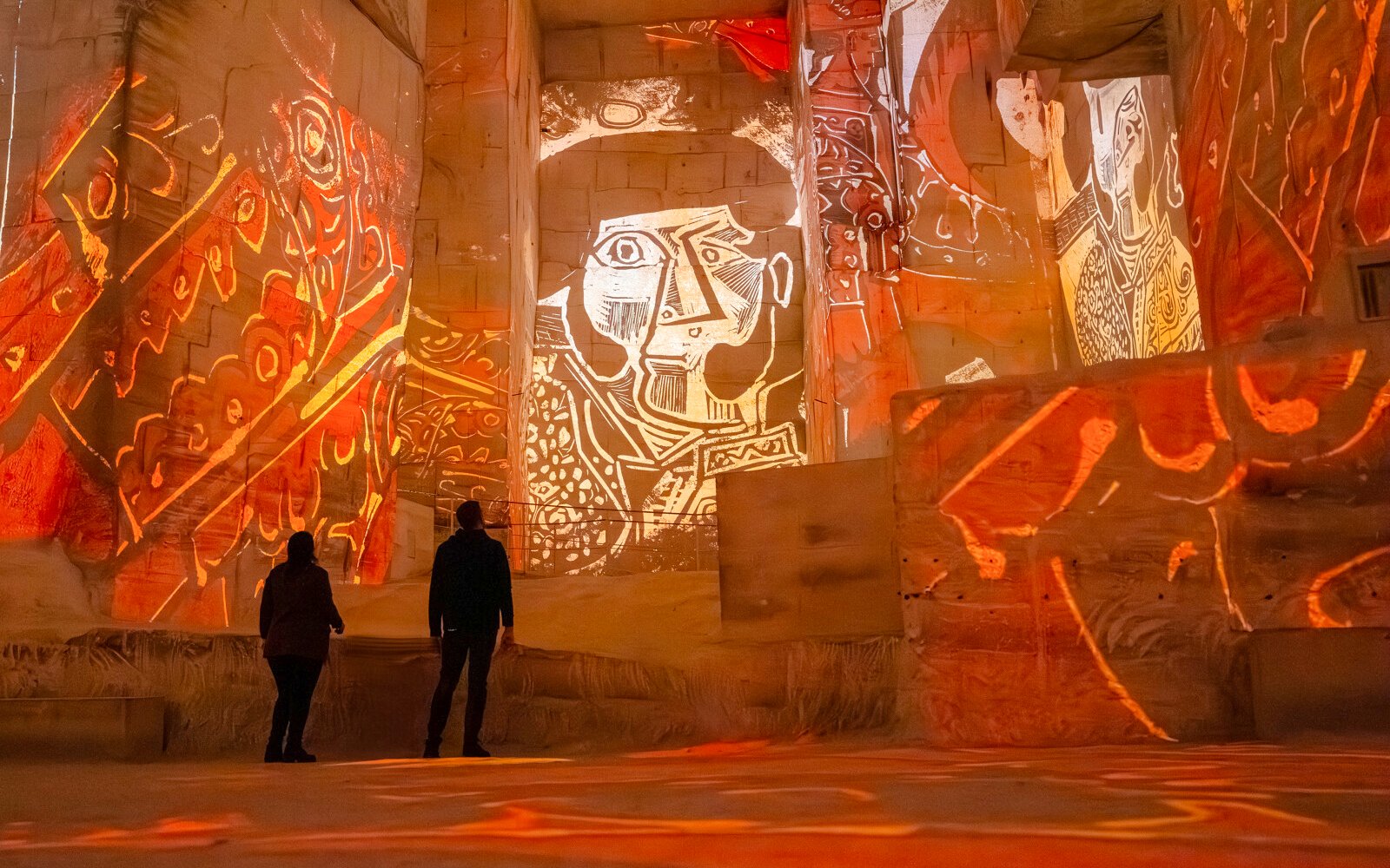 Picasso artwork projected on quarry walls at Carrières des Lumières exhibit.