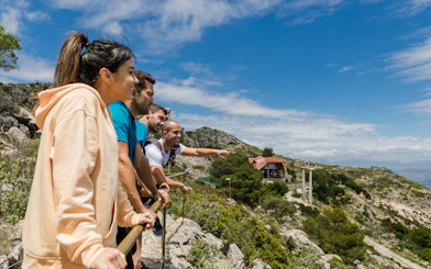 Hikers enjoying the view from Benalmádena mountain summit.