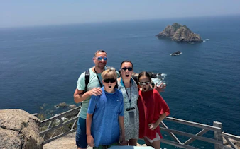 Family enjoying ocean view at Nha Trang's Green Oasis Beach.