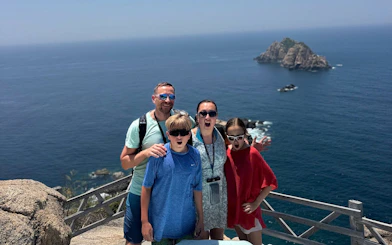 Family enjoying ocean view at Nha Trang's Green Oasis Beach.