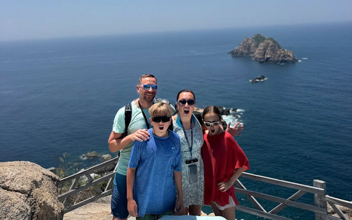 Family enjoying ocean view at Nha Trang's Green Oasis Beach.