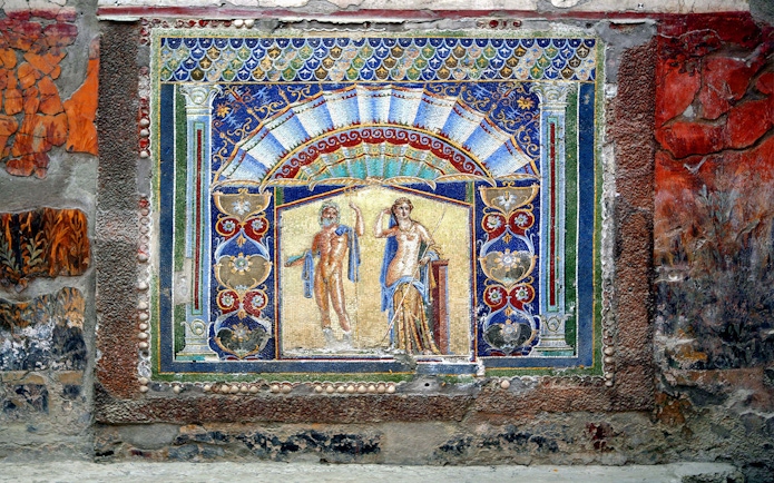 Mosaic artwork depicting mythological figures in Herculaneum, Italy.