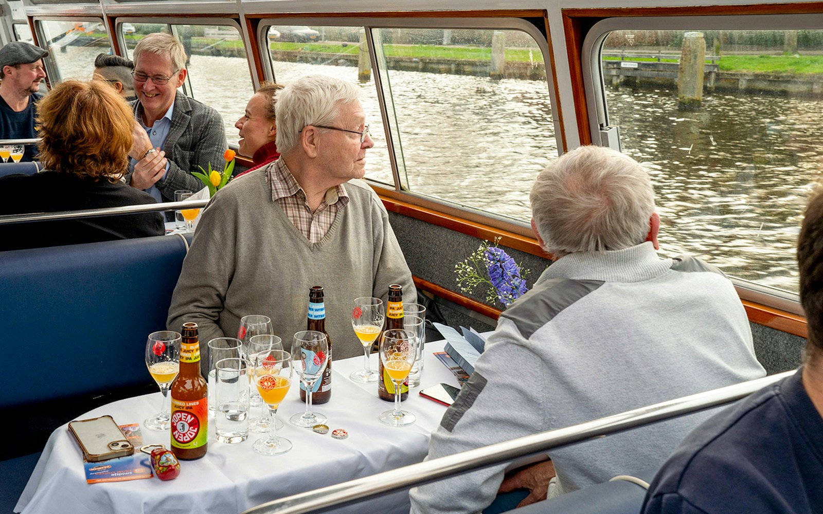 Guests enjoying beer tasting on a canal cruise in Haarlem.