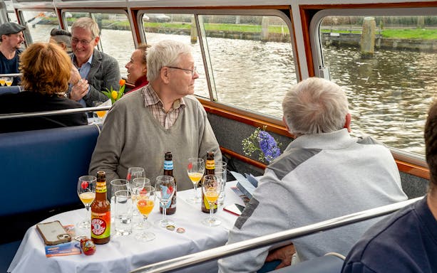Guests enjoying beer tasting on a canal cruise in Haarlem.