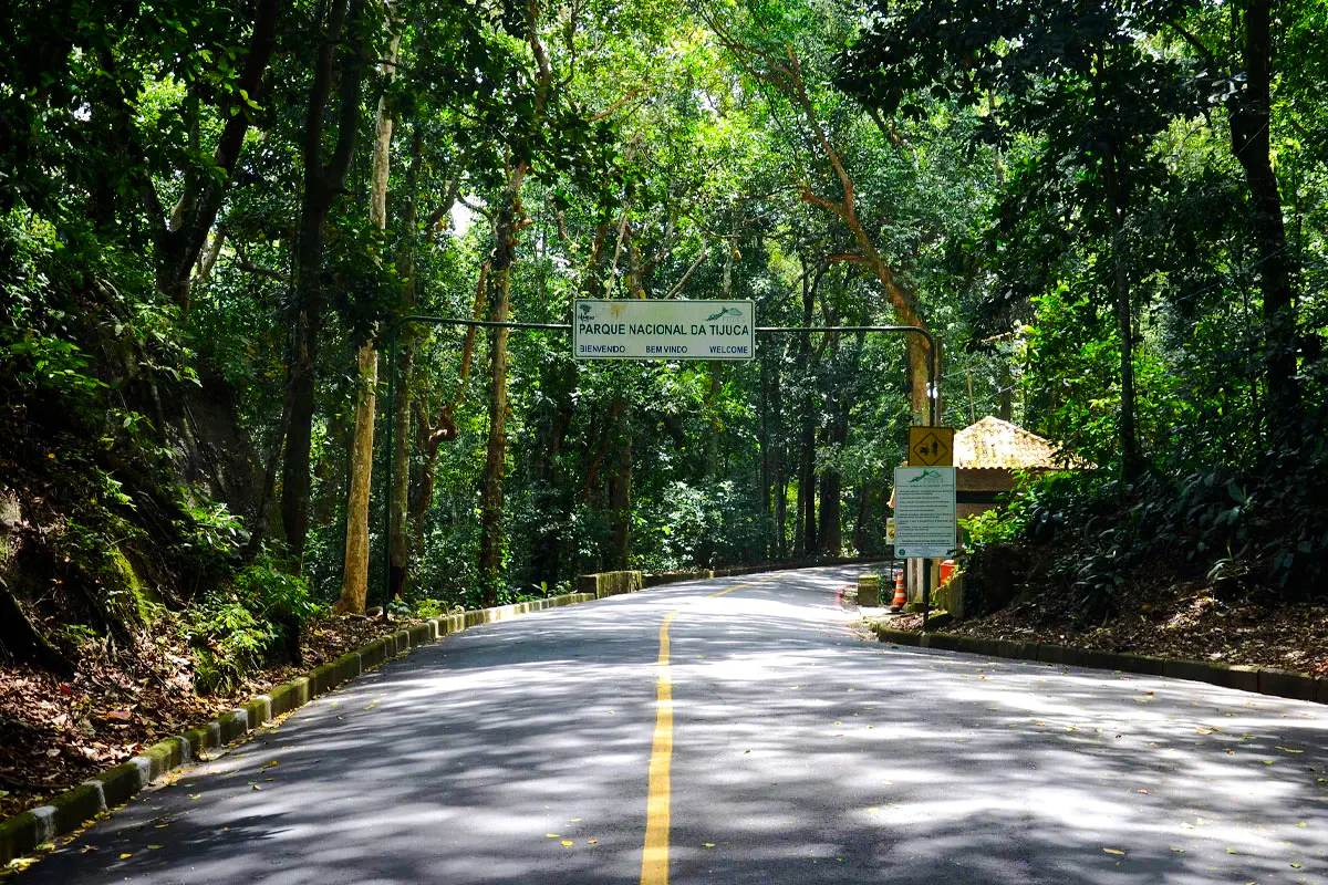 Entrance to Tijuca National Park, Rio de Janeiro, surrounded by lush forest.
