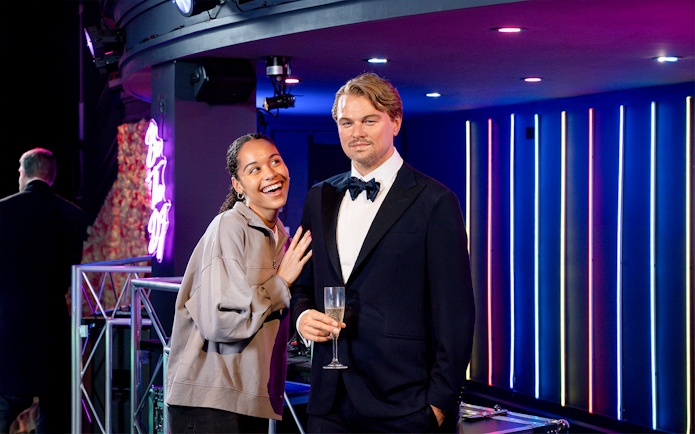 Girl posing with Leonardo DiCaprio wax figure at Madame Tussauds, New York.