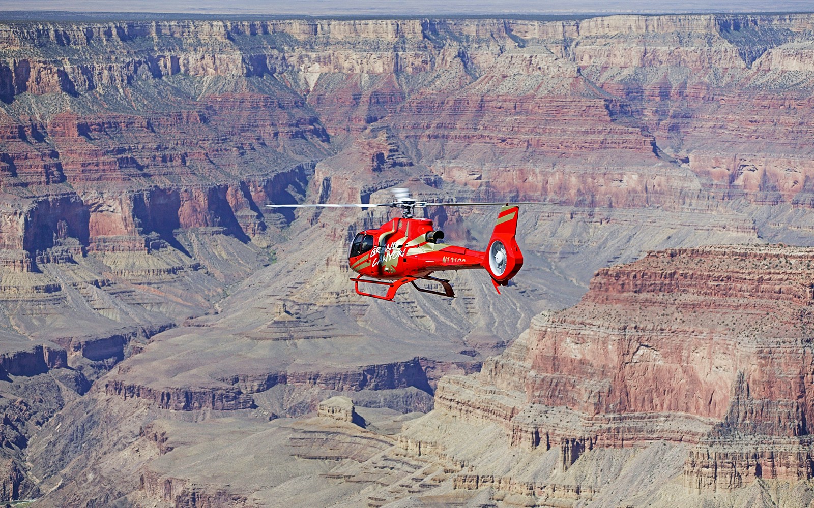Helicopter flying over the Grand Canyon, showcasing the 45-min tour experience from Las Vegas.