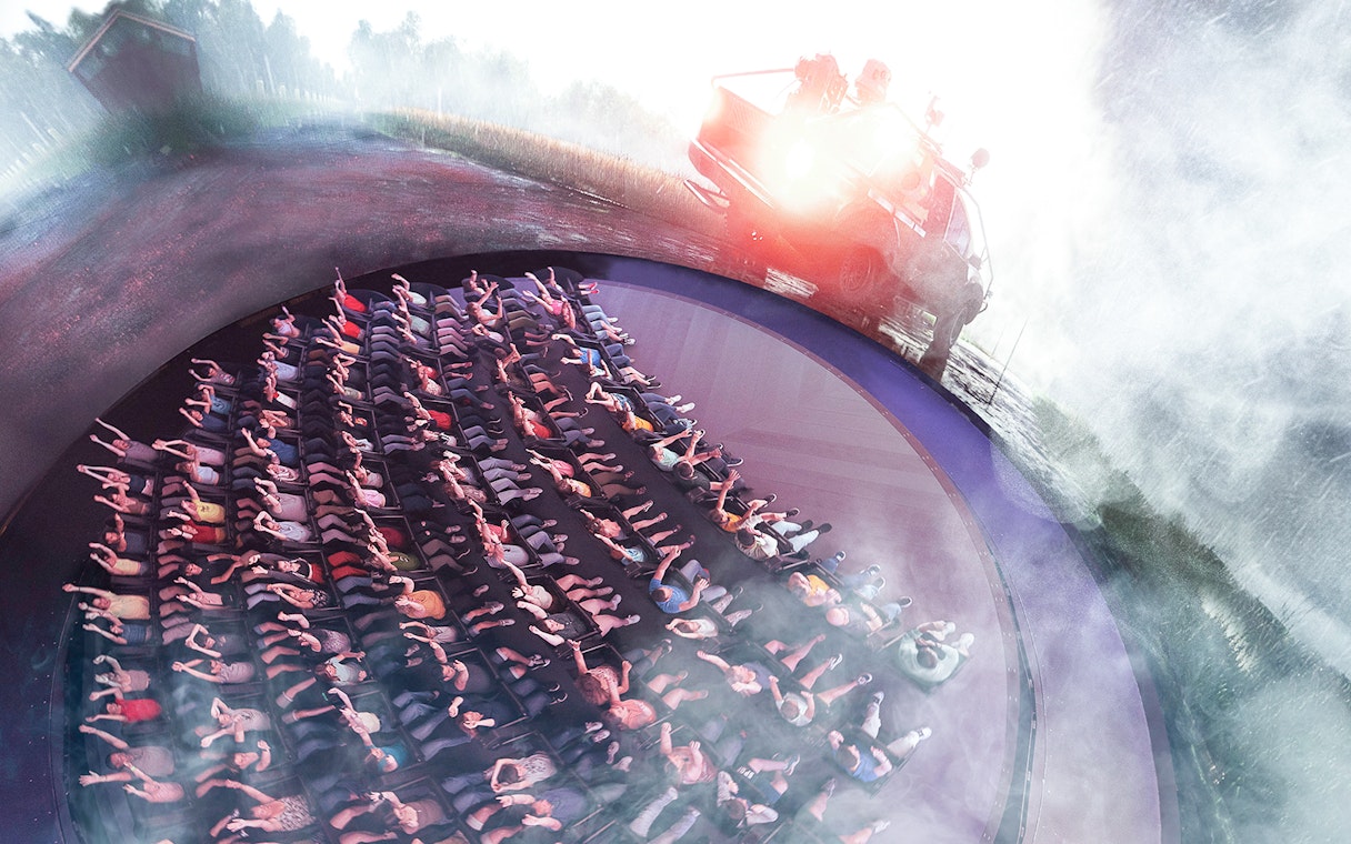Visitors experiencing Tornado Chasers attraction at Futuroscope with immersive effects.