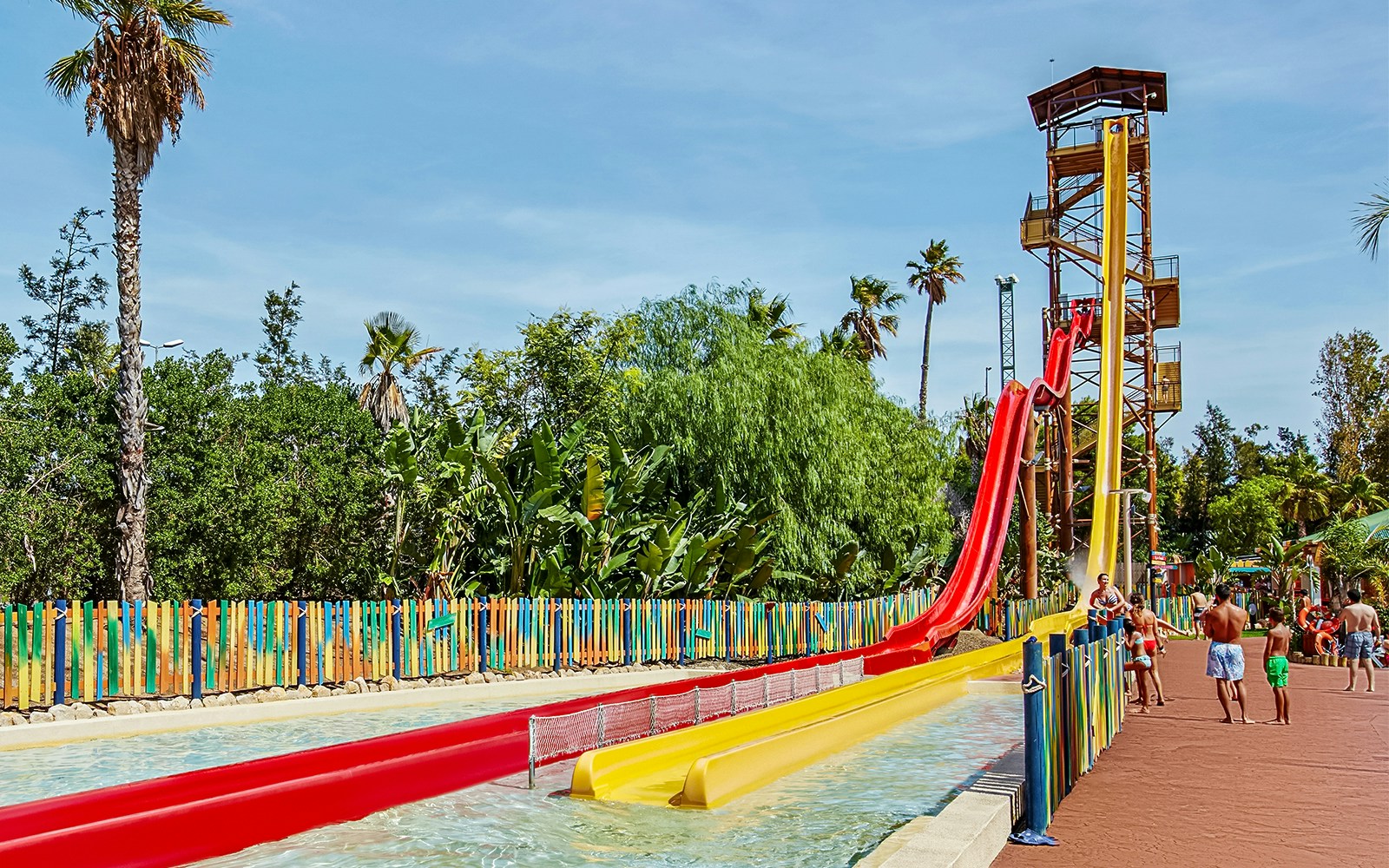 Water slide at Caribe Aquatic Park with people enjoying the ride.