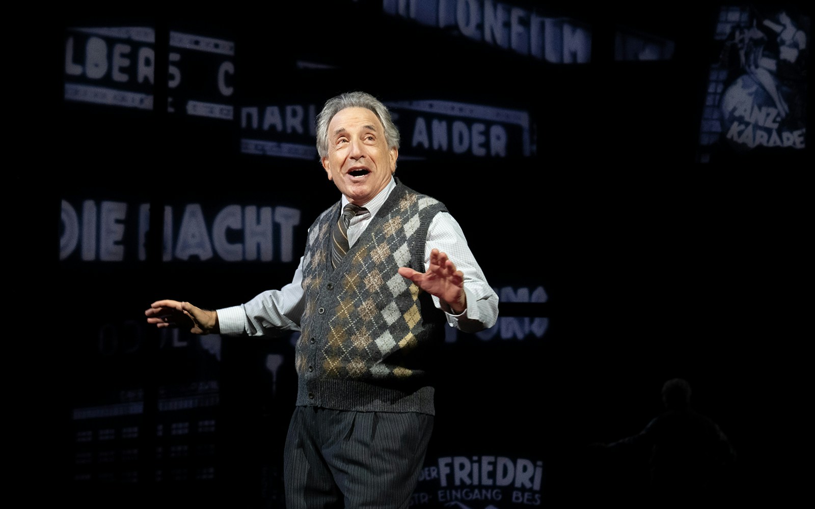 Performer on stage during "Harmony: A New Musical" with vintage backdrop.