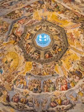 Frescoes inside Brunelleschi's Dome, Florence, depicting religious scenes and figures.