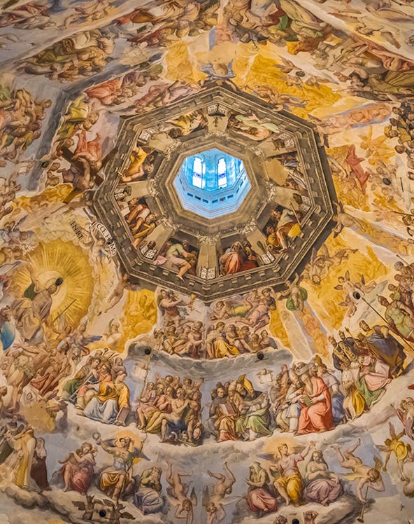 Frescoes inside Brunelleschi's Dome, Florence, depicting religious scenes and figures.