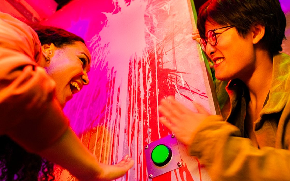 Participants solving an escape room challenge at Prison Island Brisbane.