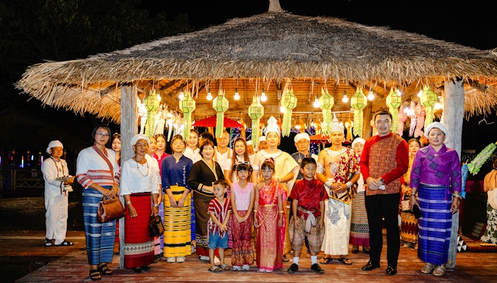 Locals and visitors in traditional attire celebrating Yi Peng and Loy Krathong Festival 2025, Chiang Mai.