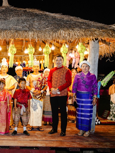 Locals and visitors in traditional attire at Yi Peng and Loy Krathong Festival, Chiang Mai 2025.