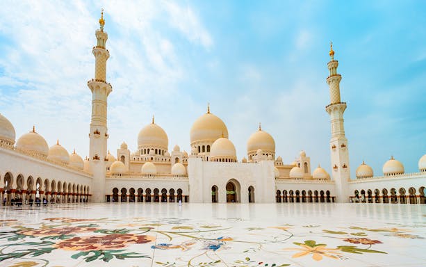 Sheikh Zayed Grand Mosque in Abu Dhabi with floral courtyard design.