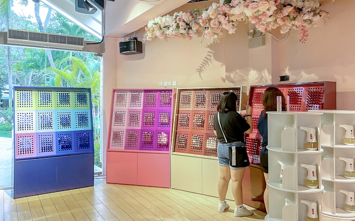 Visitors exploring fragrance displays at Scentopia Sentosa.