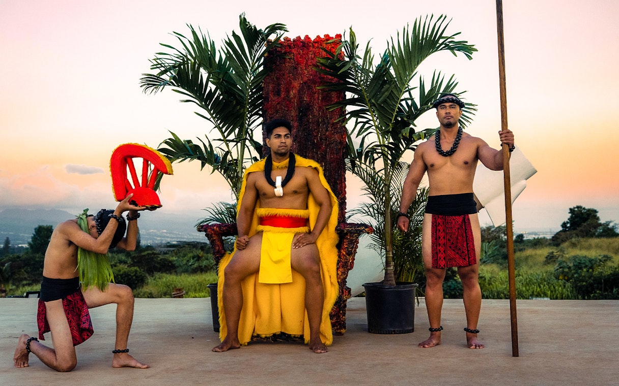 Mauka Warriors performing a cultural play with traditional attire and props.