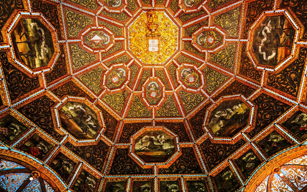 Ceiling of the Hall of Coats of Arms, National Palace of Sintra, with intricate heraldic designs.