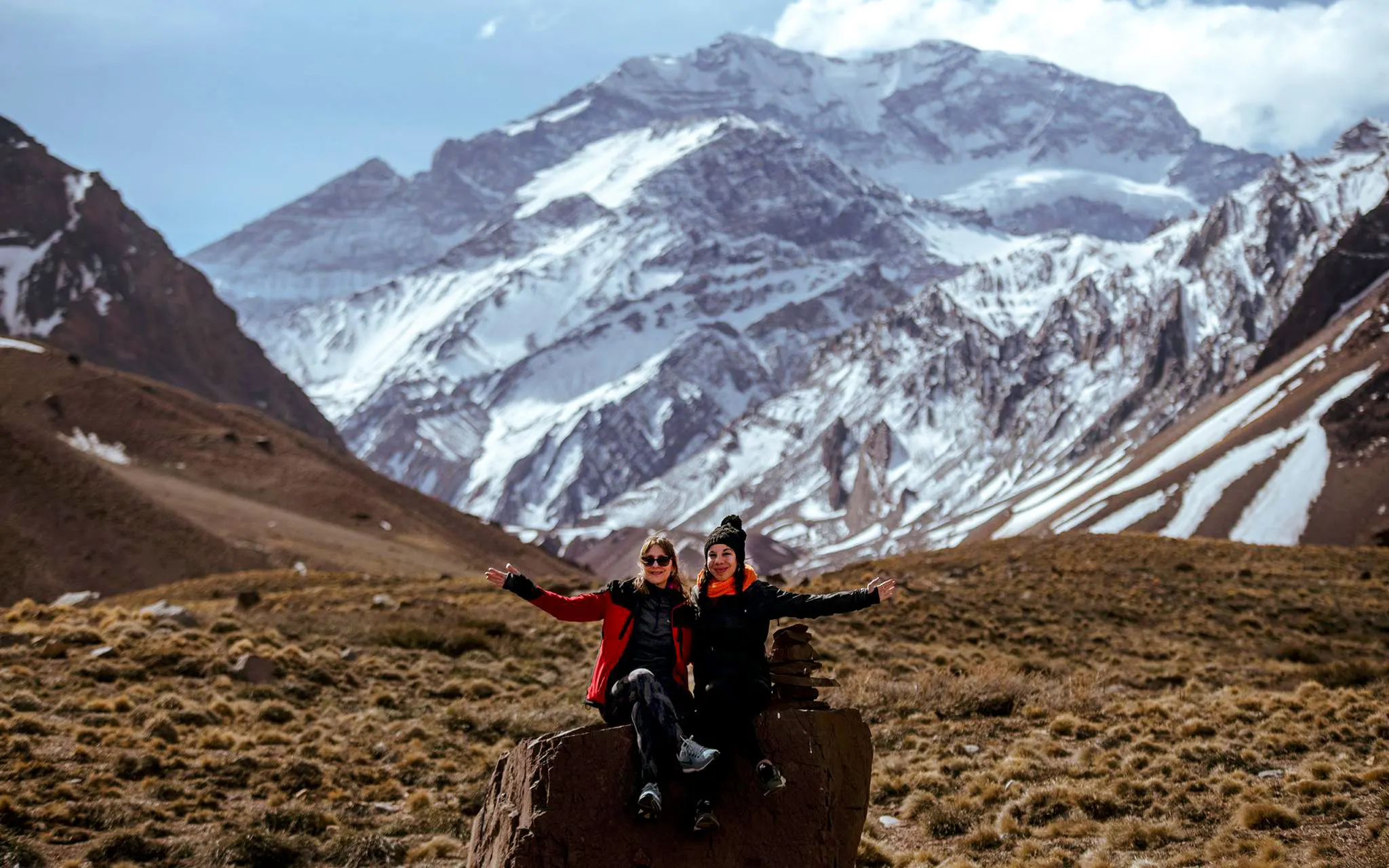 Guests enjoying the High Mountain Excursion with a local guide near snow-capped peaks from Mendoza.