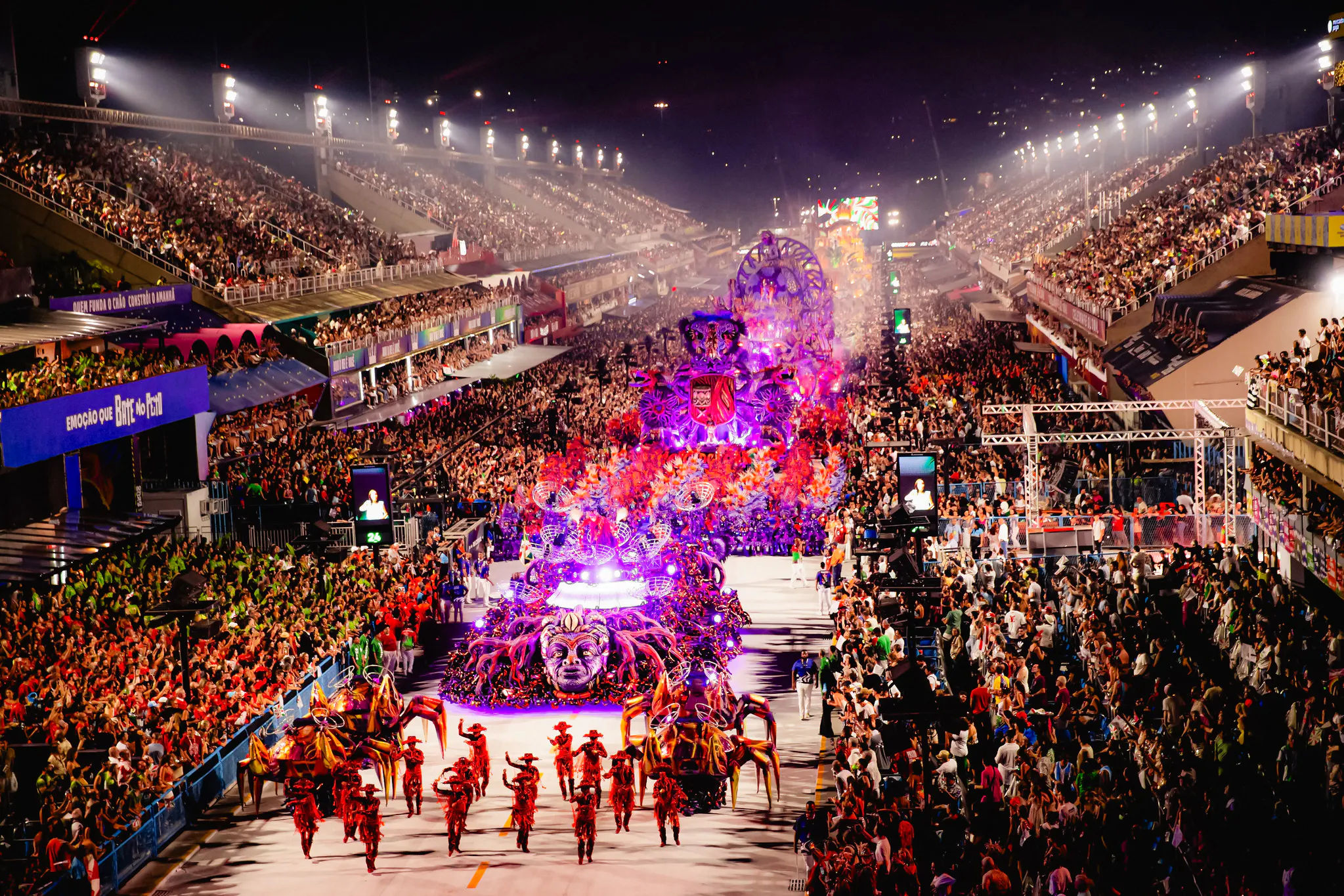 Parade at Rio Carnival 2027 with vibrant floats and dancers at Marquês de Sapucaí, Rio de Janeiro.