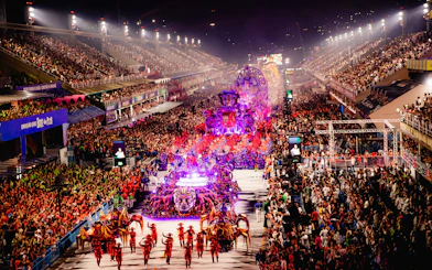 Parade at Rio Carnival 2027 with vibrant floats and dancers at Marquês de Sapucaí, Rio de Janeiro.