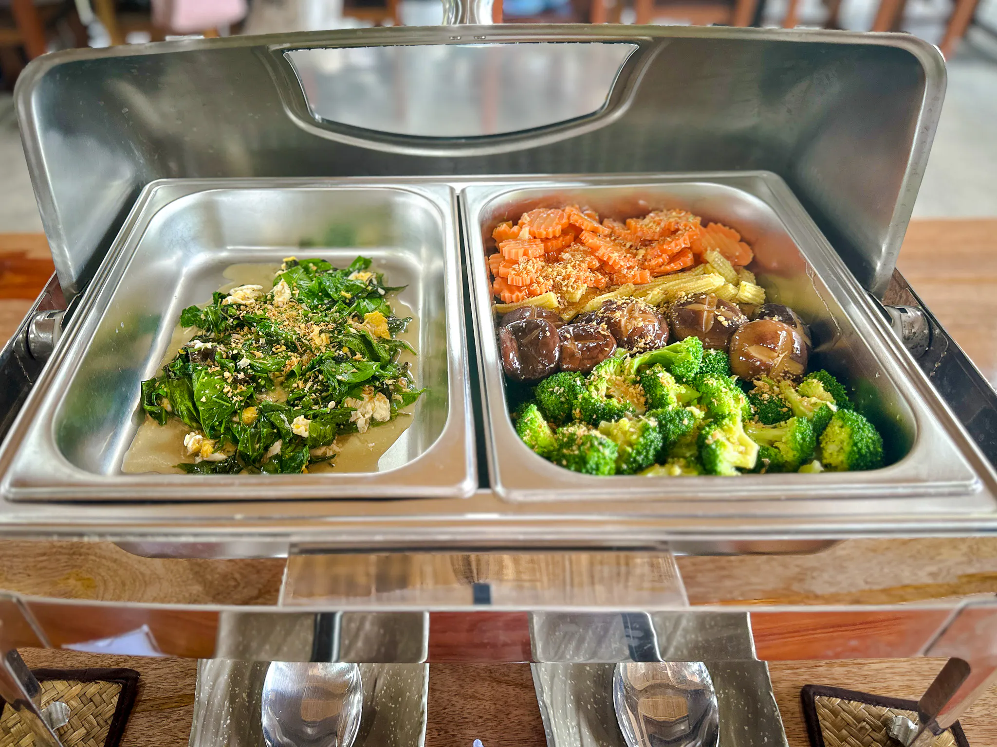 Vegetarian buffet meal at Krabi Roaming Elephant Sanctuary, featuring greens and mixed vegetables.