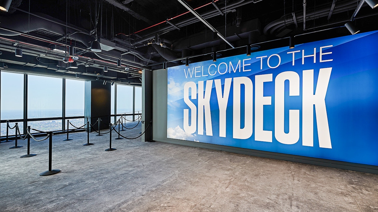 View from Skydeck at Willis Tower, Chicago, overlooking city skyline and Lake Michigan.