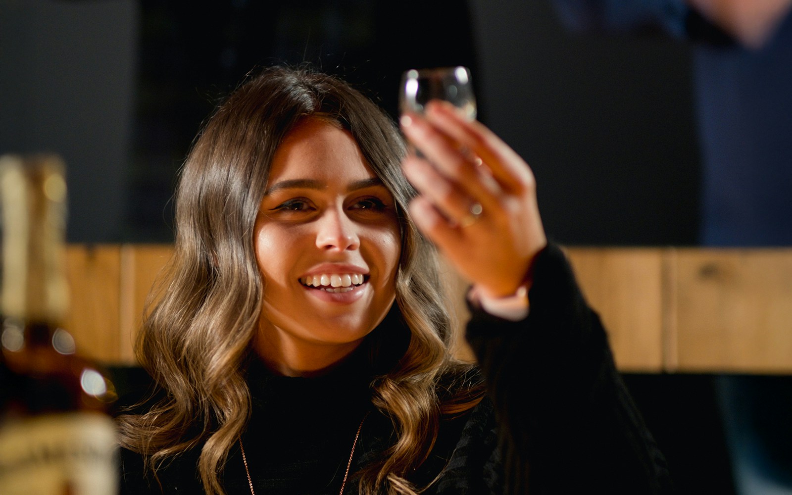 Woman enjoying whiskey tasting at Jameson Distillery tour.
