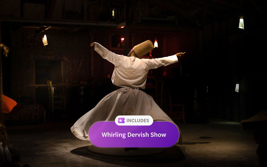 Sufi whirling dervish performing in traditional attire.