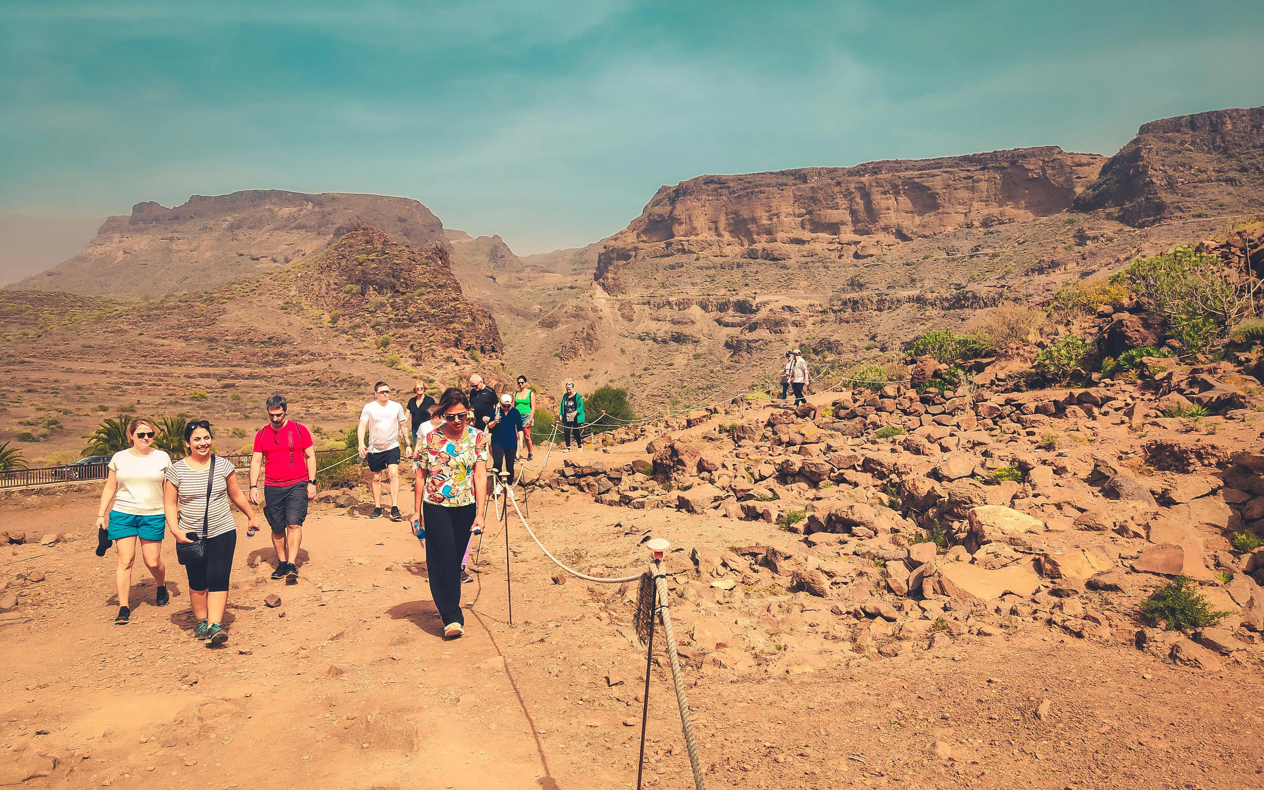Hikers on a trail at La Fortaleza de Ansite, Santa Lucía de Tirajana, Gran Canaria.