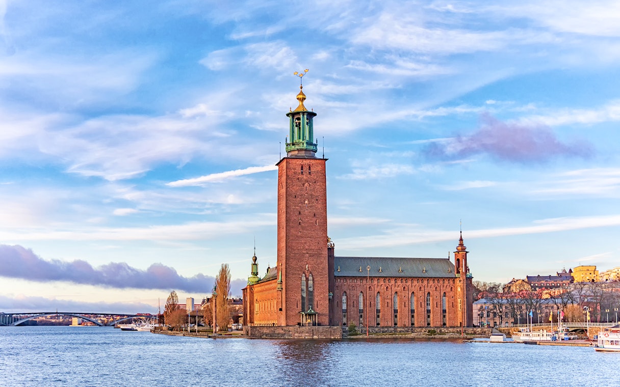 Stockholm City Hall by the water, part of the Hop-On-Hop-Off Tour.