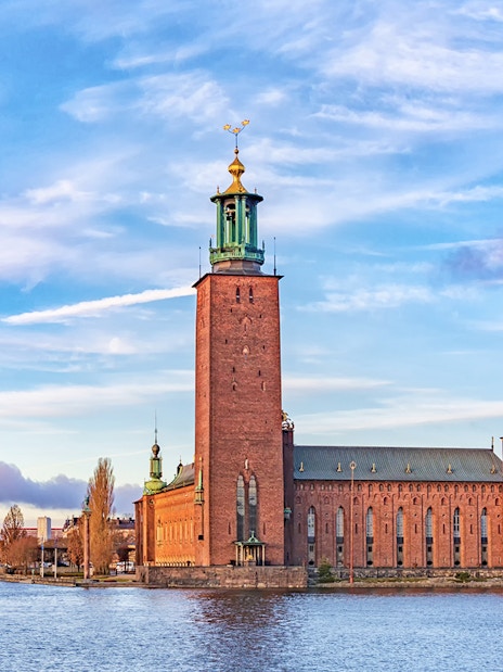 Stockholm City Hall by the water, part of the Hop-On-Hop-Off Tour.