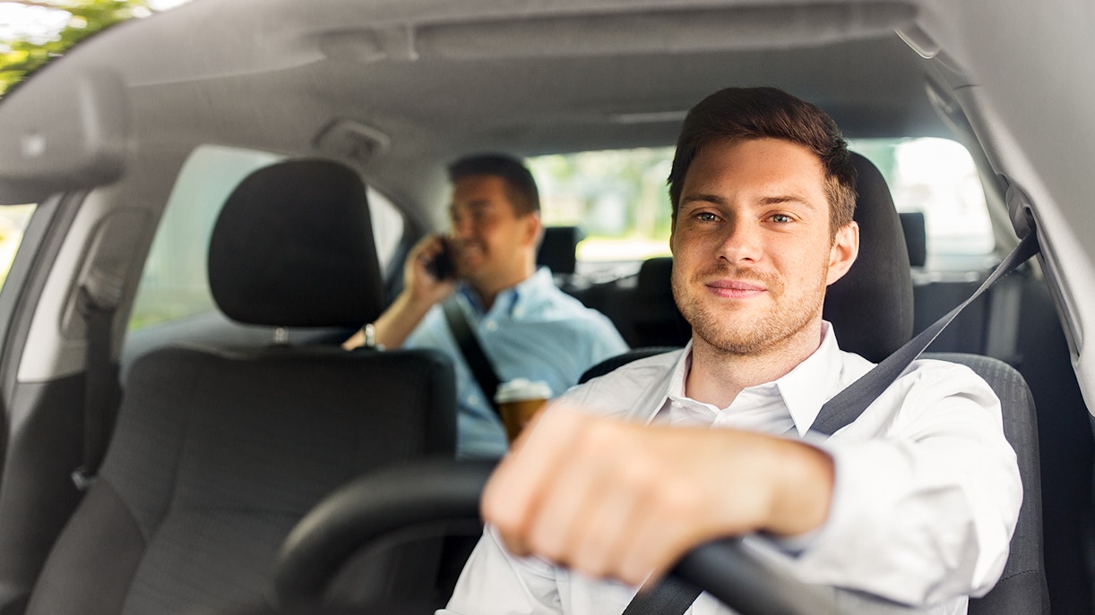 Driver transporting passenger from airport.