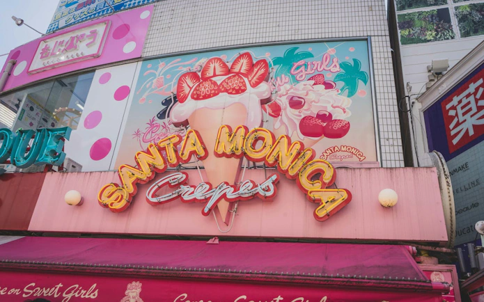 Santa Monica Crepes shop sign on Cat Street, Tokyo, during Shibuya Sky walking tour.