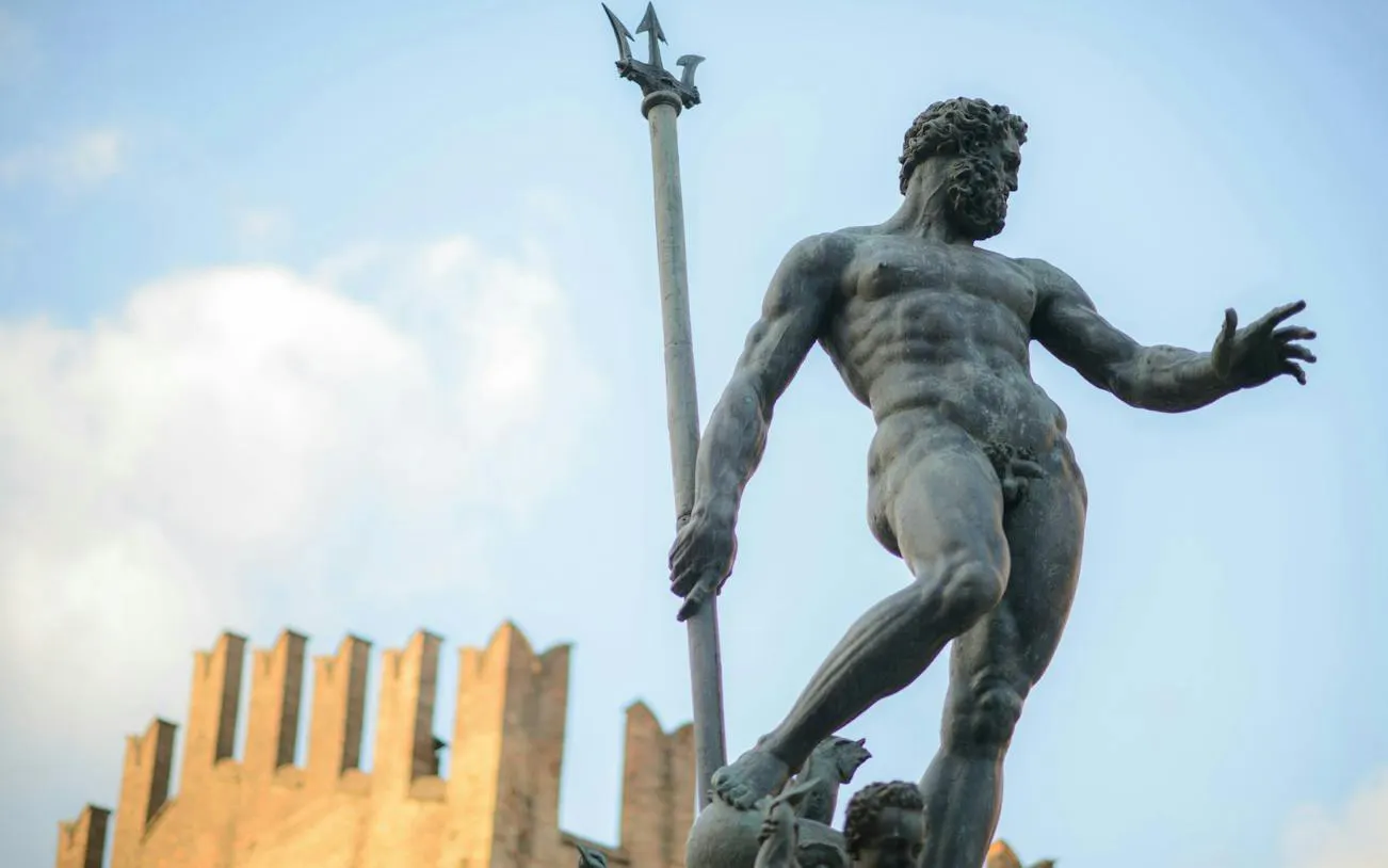 Neptune statue in Bologna's Piazza Maggiore, part of the self-guided city exploration game.