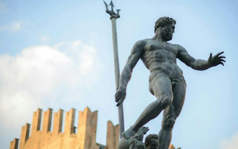 Neptune statue in Bologna's Piazza Maggiore, part of the self-guided city exploration game.
