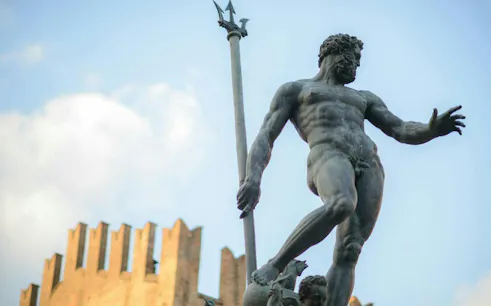 Neptune statue in Bologna's Piazza Maggiore, part of the self-guided city exploration game.